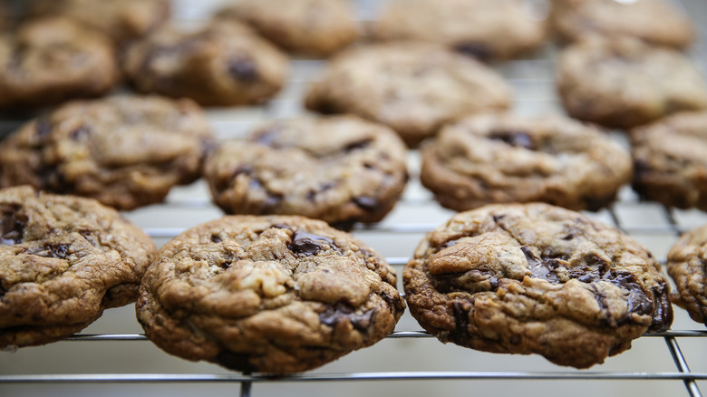 gooey cookies on a baking rack