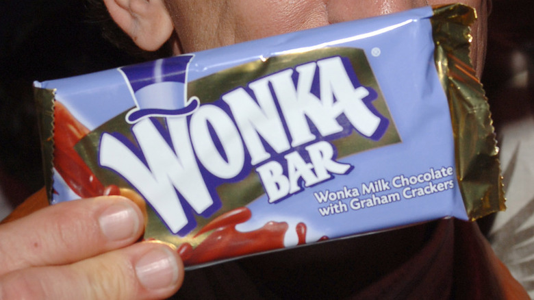 hand holding Wonka Bar in wrapper