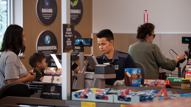Aldi cashier checking out customer