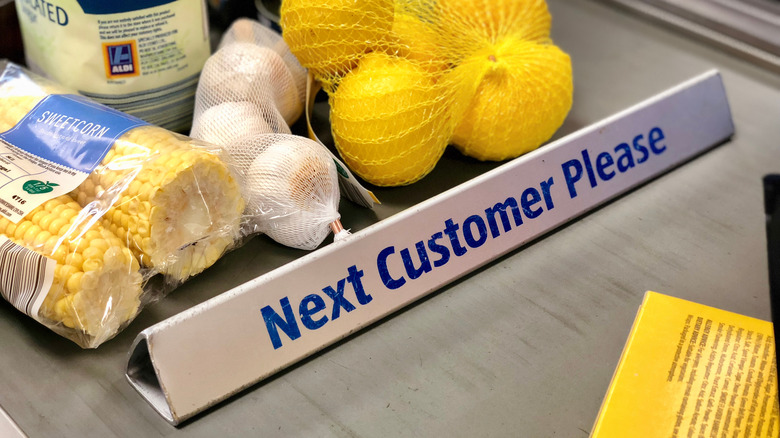 Aldi register belt with products