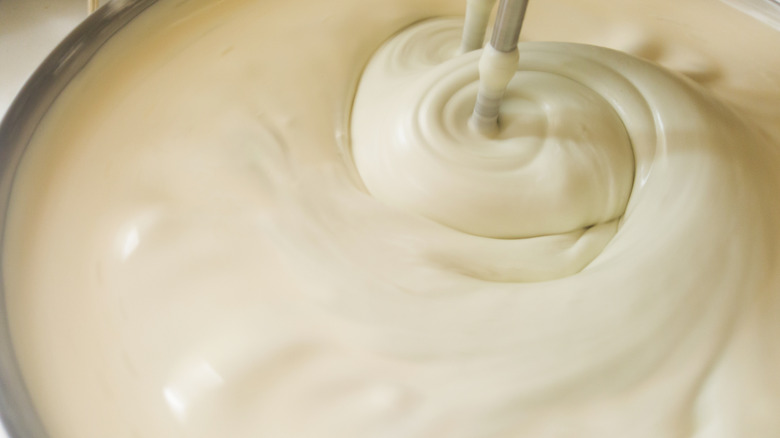 Creamy mixture being stirred 