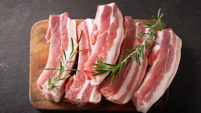 Raw ribs placed on cutting board