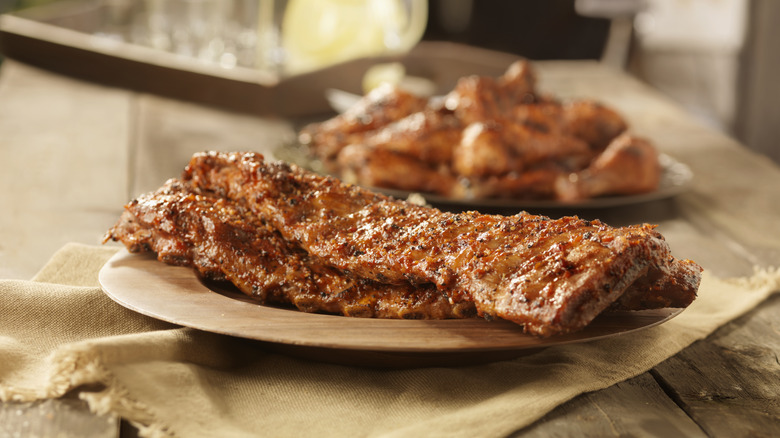 Seared ribs on a plate on a table
