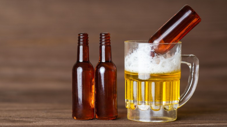 empty bottles in beer glass