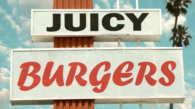 vintage sign advertising juicy burgers