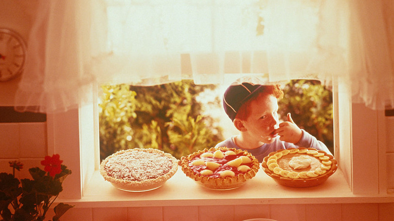 Woman in apron with retro pie