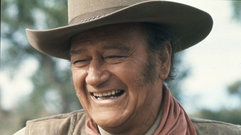 John Wayne in cowboy hat smiling