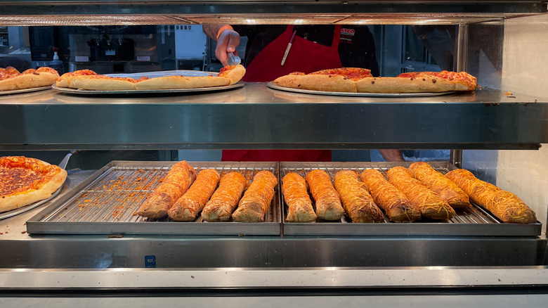 Costco chicken bakes at food court beneath pizza