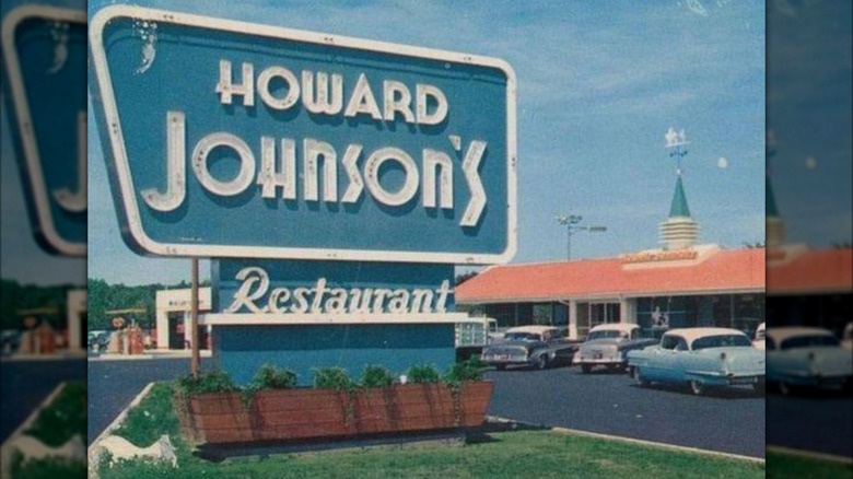 A vintage picture of a Howard Johnson's sign, outside one of its restaurants