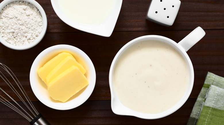 Pitcher of béchamel sauce with butter and flour