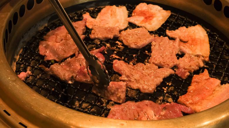Slices of meat on a grill