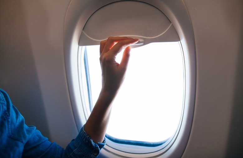 Flight Attendant Open Airplane Window