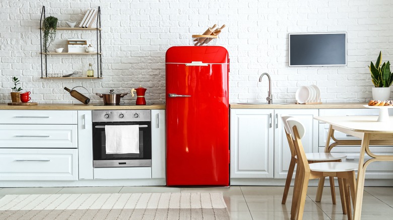 kitchen with bright red fridge