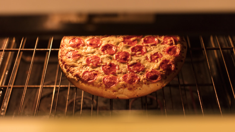 Pepperoni pizza in oven