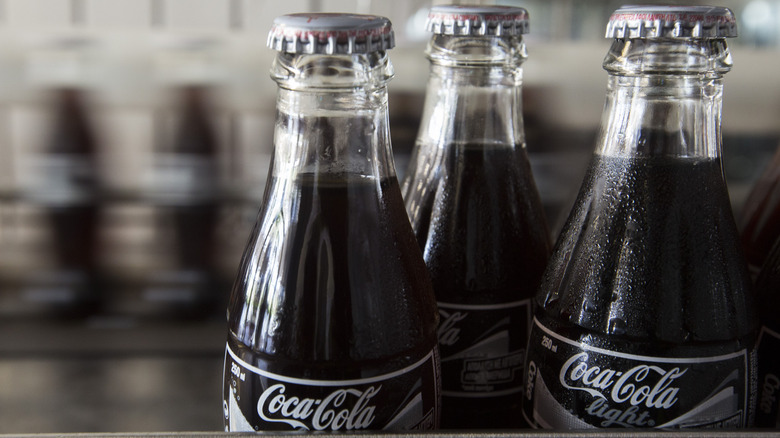 Glass coke bottles on conveyor