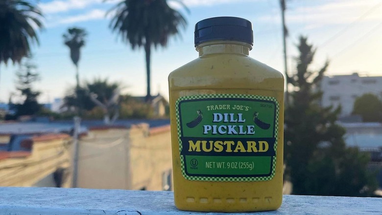 A bottle of Trader Joe's dill pickle mustard outside