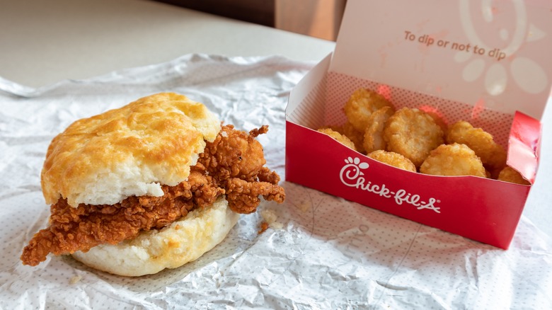 A Chick-fil-A biscuit and box of hasbrowns