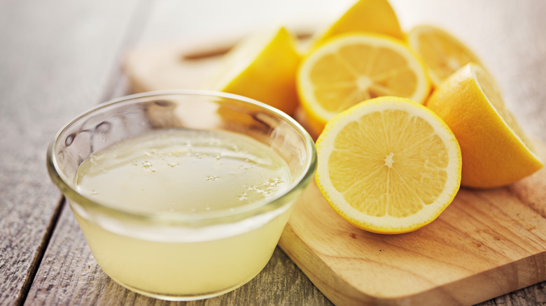 Fresh lemon juice with lemons