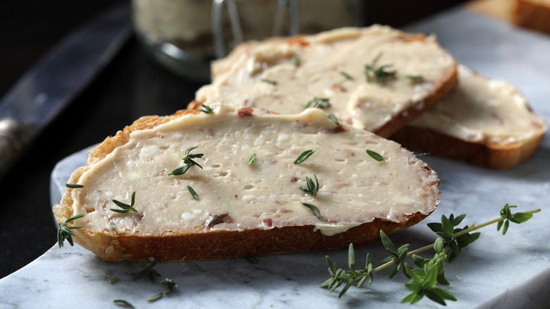 Anchovy butter with herbs on toasts