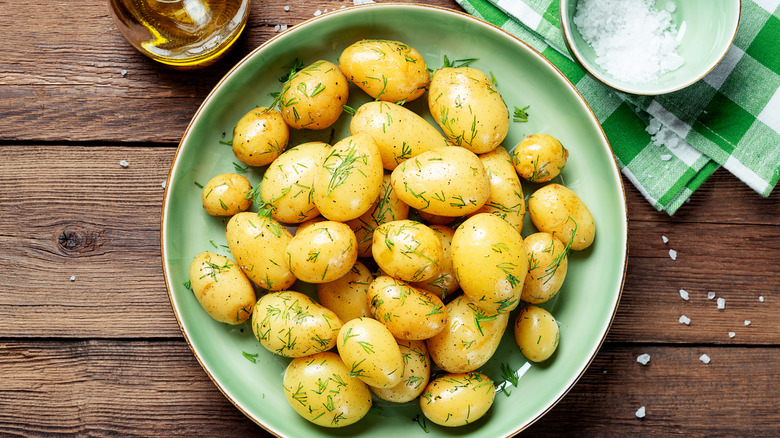 Plate of boiled potatoes with herbs