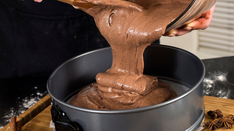 Cake batter being poured into a pan