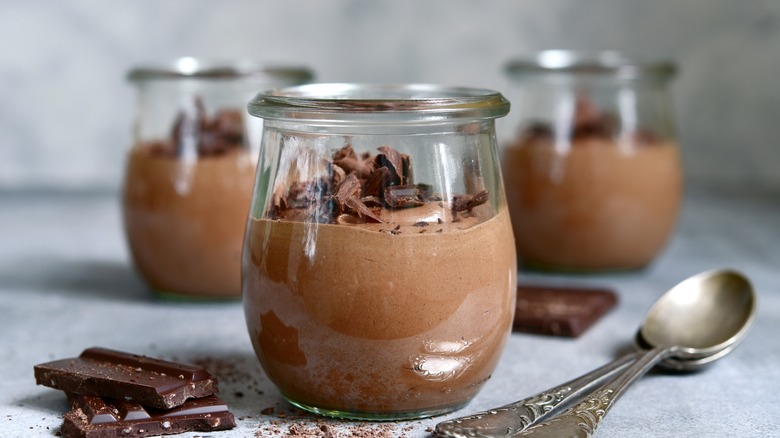 Cups of chocolate mousse with spoon