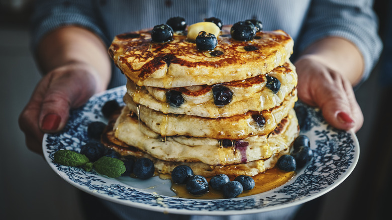 Stack of blueberry pancakes on plate