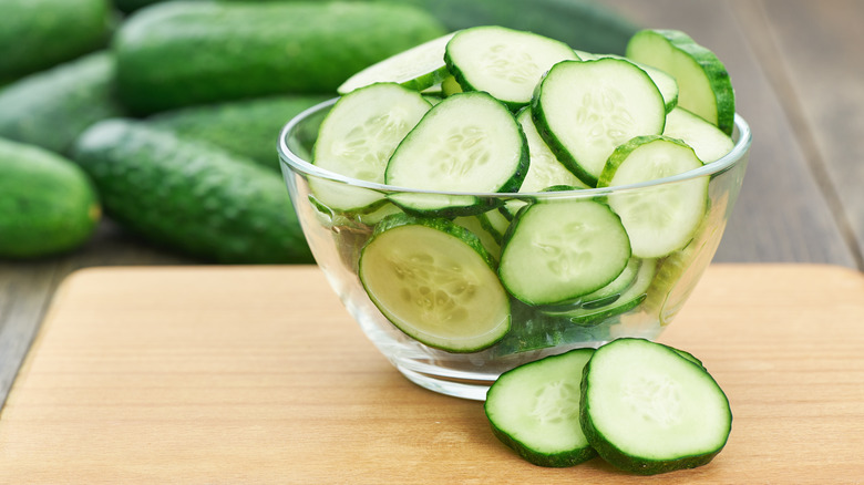 Sliced and whole cucumbers