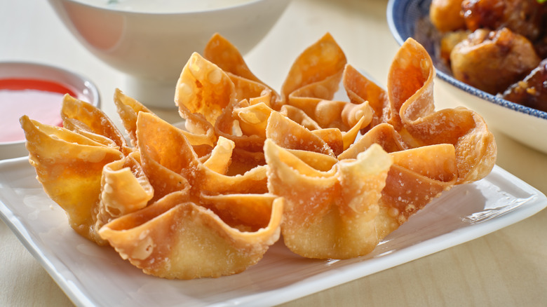 Crab rangoon fried wontons on plate