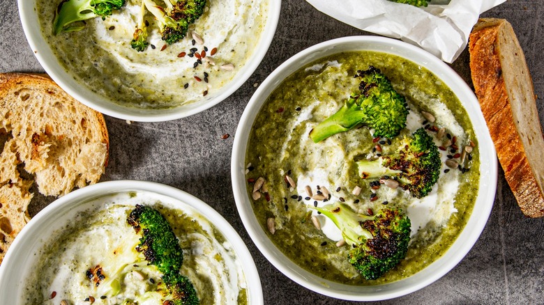 Three bowls of roasted broccoli soup 