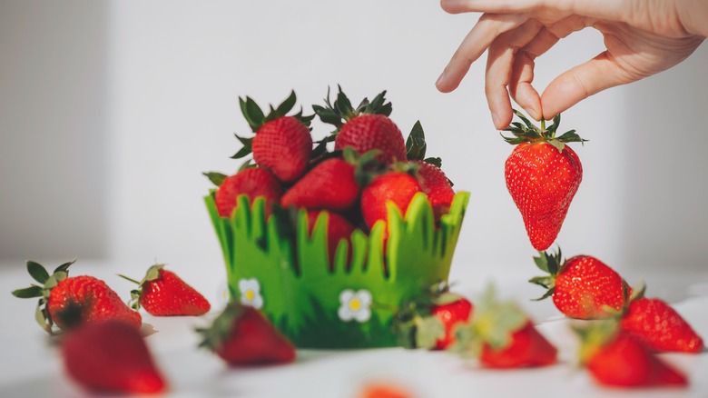Green basket of strawberries