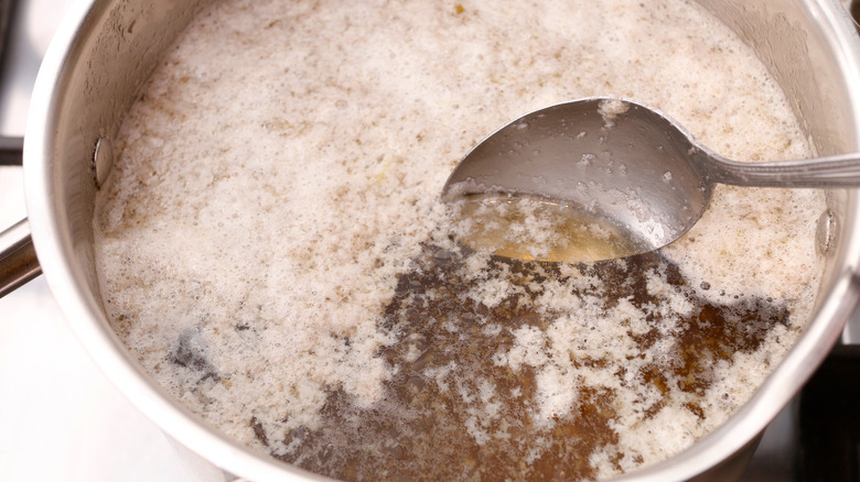 Cloudy stock with scum