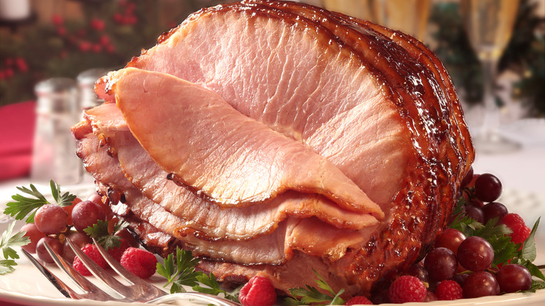 Spiral cut ham garnished with fresh fruit