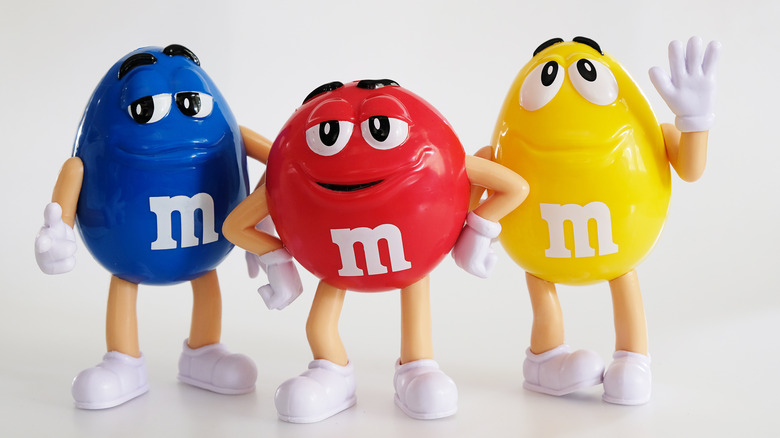 Blue, Red, and Yellow M&M's characters smiling