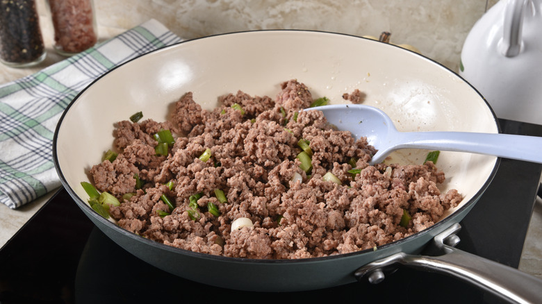 cooking ground beef in a pan 