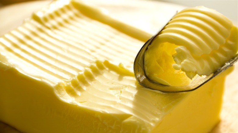 softened butter and butter curler