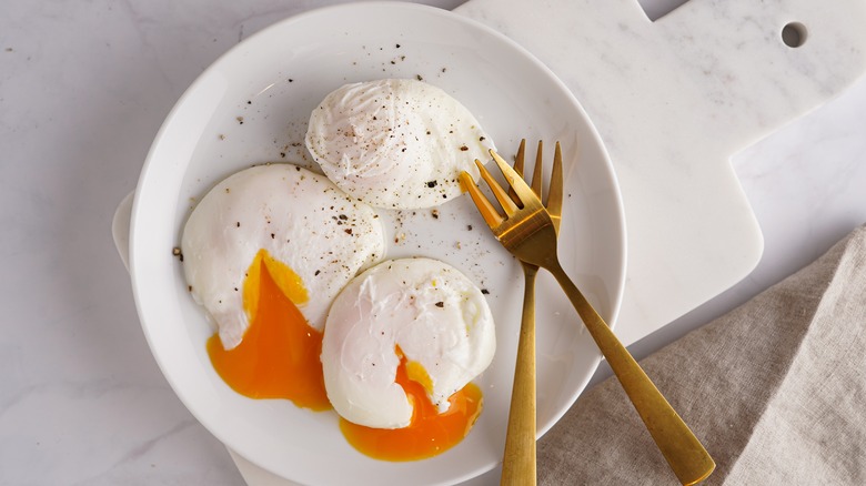 plate of three poached eggs