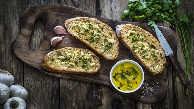 Garlic bread on wooden board