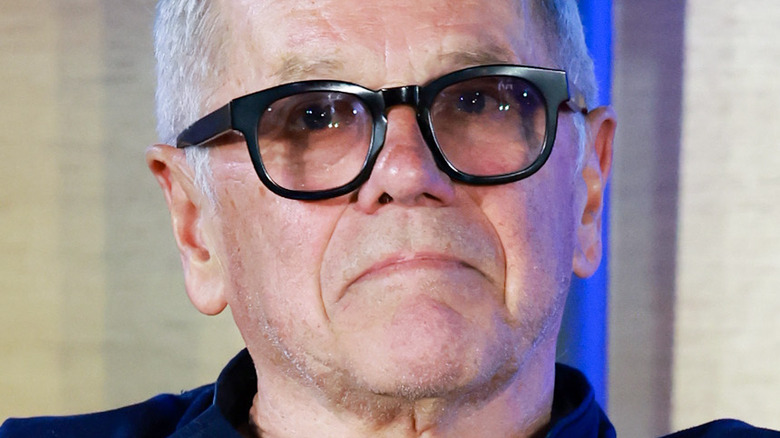 Wolfgang Puck frowning with glasses