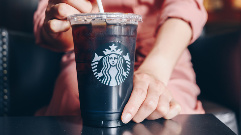 Person with Starbucks cold brew
