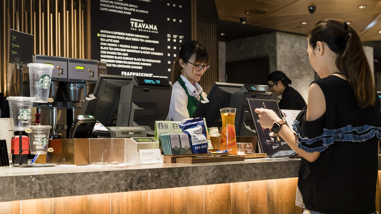 Woman at Starbucks counter 