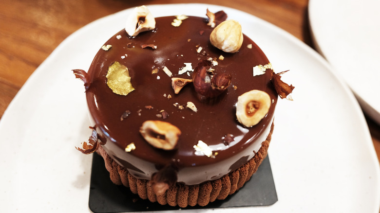 chocolate cake with hazelnuts on top