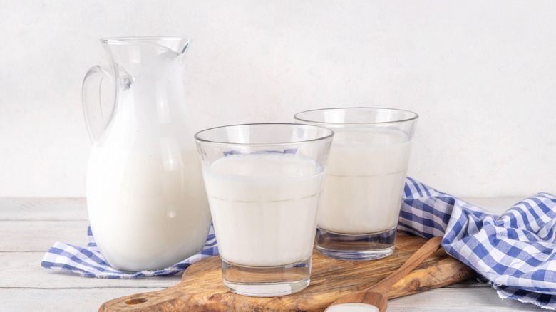 Buttermilk in jug and two glasses