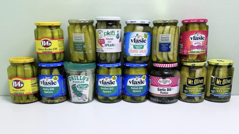 Jars of pickles stacked together; light background
