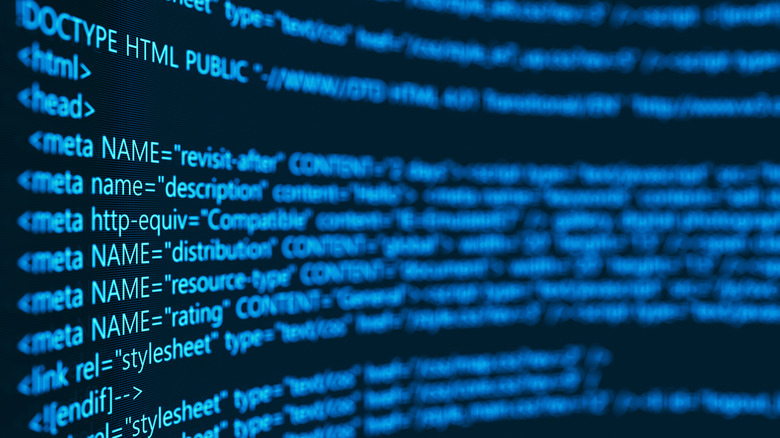 A concept of programming source code, with code shown on a computer screen