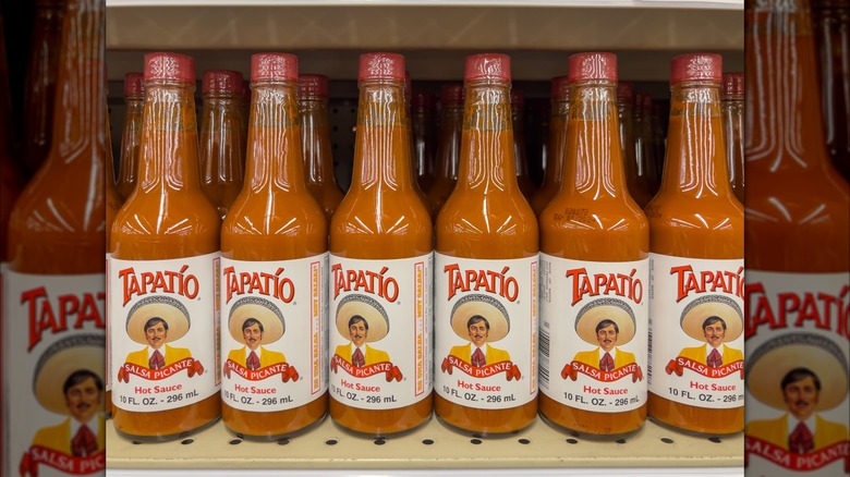 Grocery store shelf with bottles of Tapatio brand Salsa Picante Hot Sauce