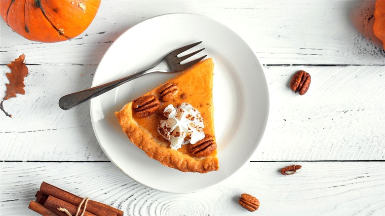 Slice of pumpkin pie with fork 