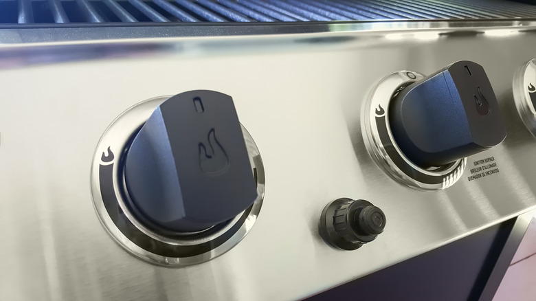 Close up of gas grill ignition buttons