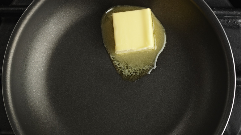 Butter melting on nonstick pan