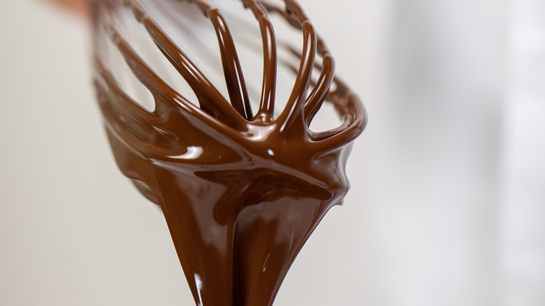 Melted chocolate on a whisk 